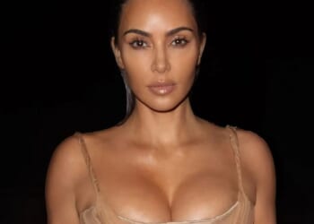 Busty Kim Kardashian wows in luxury Alexander McQueen gown as she takes late night dip at Rio beach