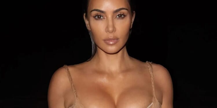 Busty Kim Kardashian wows in luxury Alexander McQueen gown as she takes late night dip at Rio beach