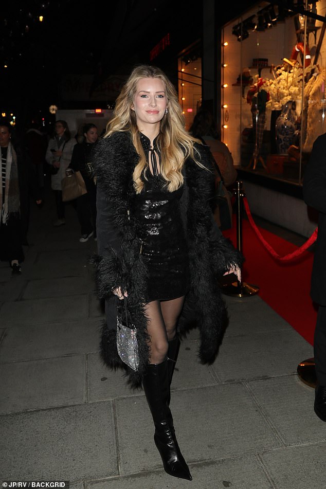 Lottie Moss wore the black version of the coat as she strutted out of the bash