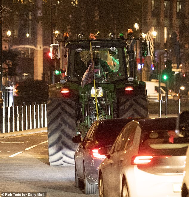 Another tractor making its way through the streets of London after farmers had been banned from bringing their tractors to a planned protests today ahead of the Budget