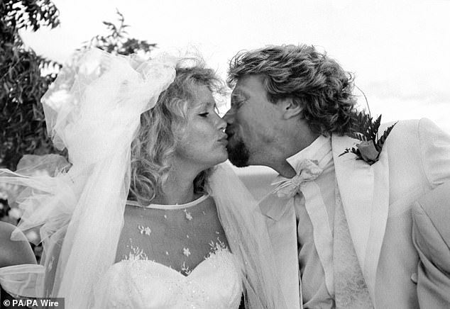 Sir Richard and Lady Joan share a kiss on their wedding day in Necker Island