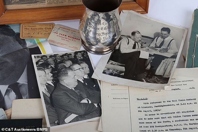 Photos of Detective Chief Superintendent Millen, along with membership cards and papers