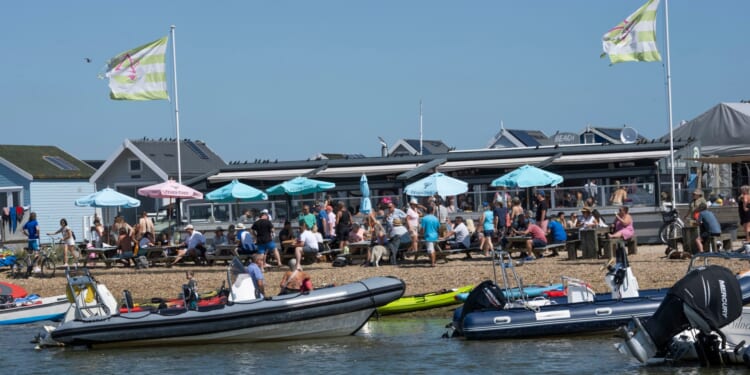 Fuming beach hut owners win fight against ‘unbearable’ restaurant 'turning seaside town into Ibiza & Magaluf rave scene'