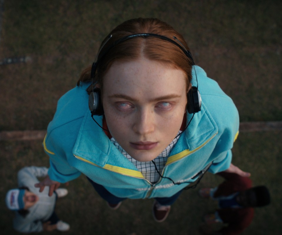 Max Mayfield with her eyes rolled back and headphones on.