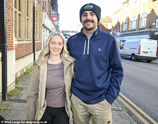 Vince Demarzo, 28, (right) with his partner Rebecca Cody, 29. They felt the Budget would be unfair to high earners