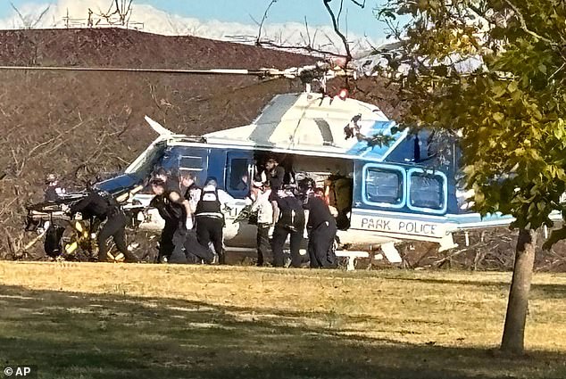 A U.S. Capitol Park Police helicopter is seen on the National Mall evacuating a National Guard shooting victim