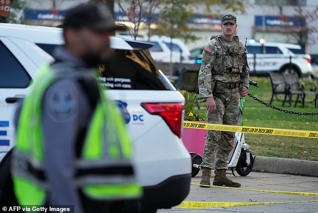 An injured soldier was seen receiving medical attention inside an ambulance at the scene of the shooting