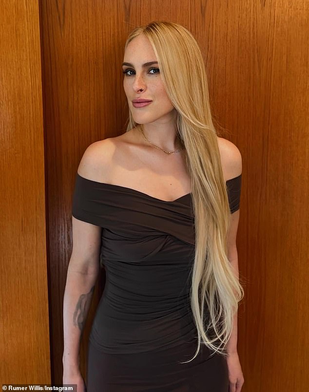 Willis bared her shoulders in a $175 CHAM 'Heidi' brown top, matching $250 'Bowie' maxi-skirt and black Worldtone Dance booties selected by stylist Maeve Reilly