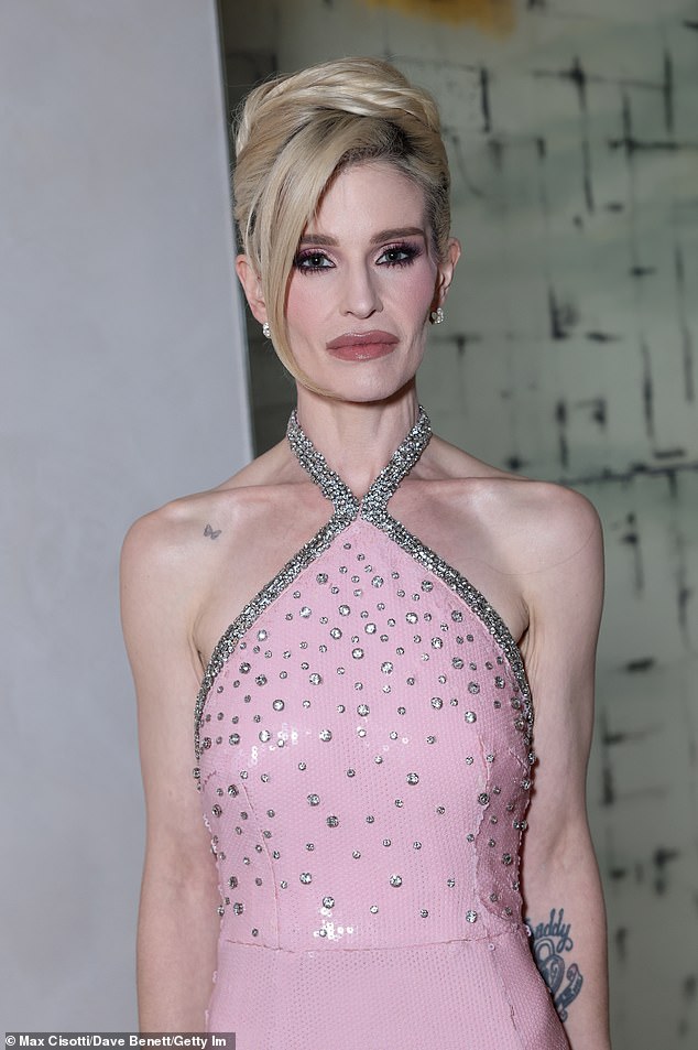Kelly looked incredible as she slipped into a pale pink gown, with a halterneck detailing