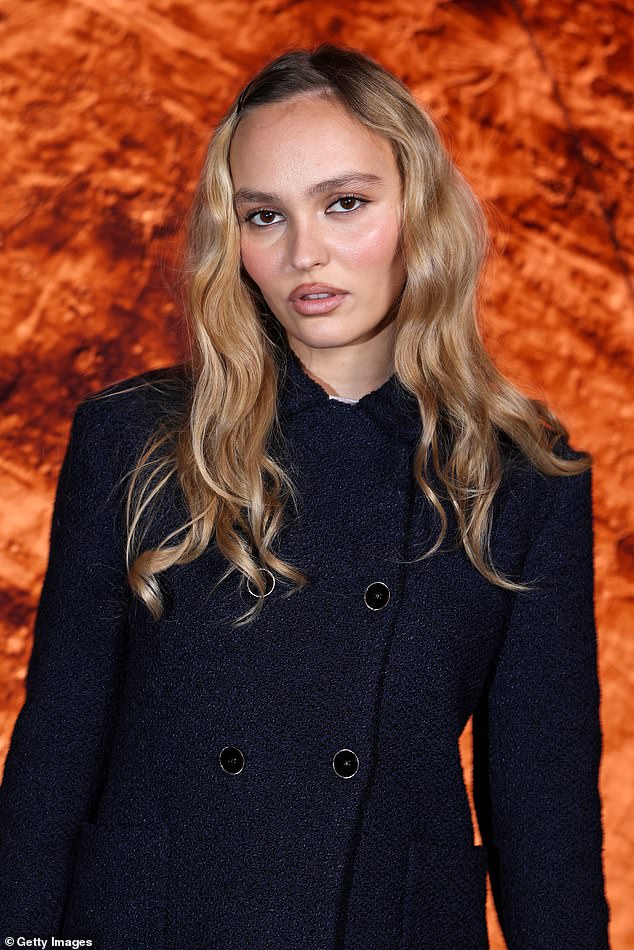 In contrast to her usual glamorous outfits, Lily-Rose sported a 13th-century-era costume made up of a shapeless brown smock and burgundy headscarf, as she held a baby wrapped in swaddling cloth (pictured last month)