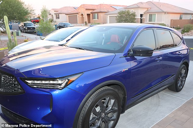 The blue 2023 Acura MDX parked in the driveway of the family home in Marana, Arizona on July 9, 2024 - the day Parker died