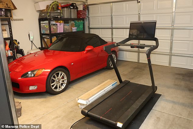 The Acura was usually parked in the garage, but his wife Erika bought him a Peloton treadmill for Father's Day three weeks earlier that was being stored there (pictured)