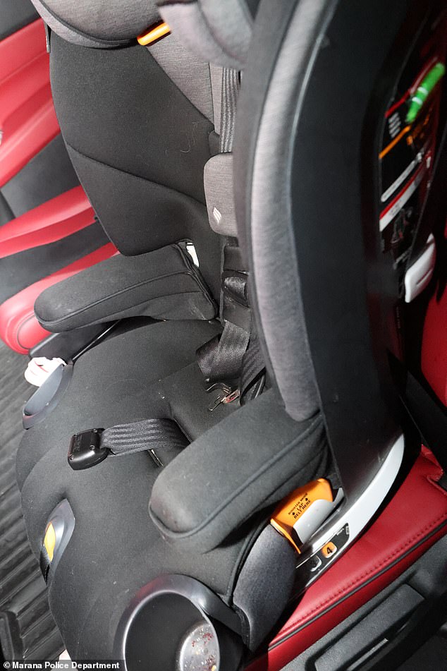 Parker was trapped in her Chicco forward-facing car seat buckled in to the back seats