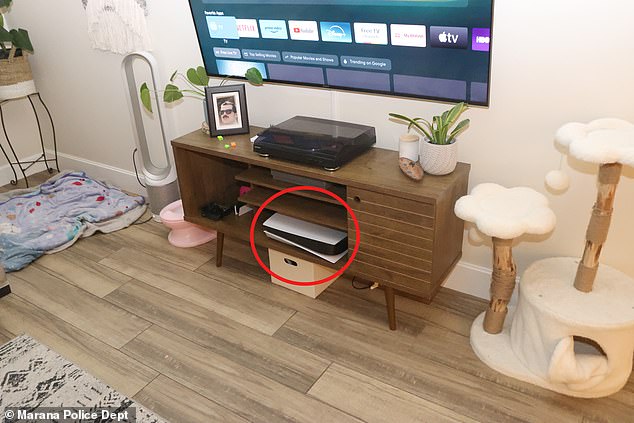 Scholtes played video games on his PlayStation 5 (circled) for much of the three hours Parker was left in the car, slowly dying