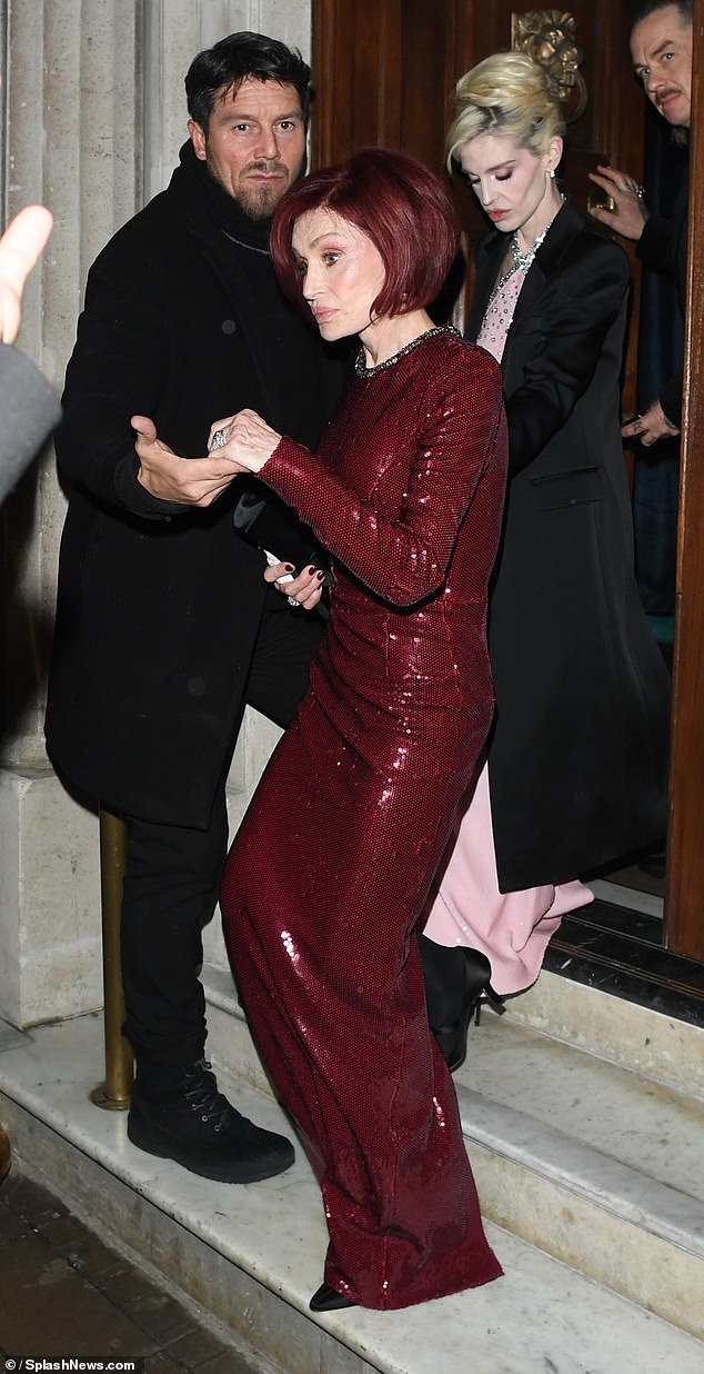 The former X Factor judge stepped out with her daughter Kelly for an event at Aki London, a lavish Japanese restaurant in London - but do YOU recognise the doorman helping her?