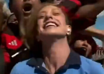 Shocking moment football yob performs 'revolting' act on female reporter live on TV sparking outrage