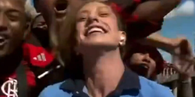 Shocking moment football yob performs 'revolting' act on female reporter live on TV sparking outrage