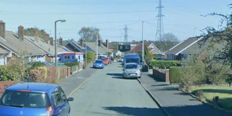 Man in his 50s dies in quiet cul-de-sac as cops launch murder probe and arrest five