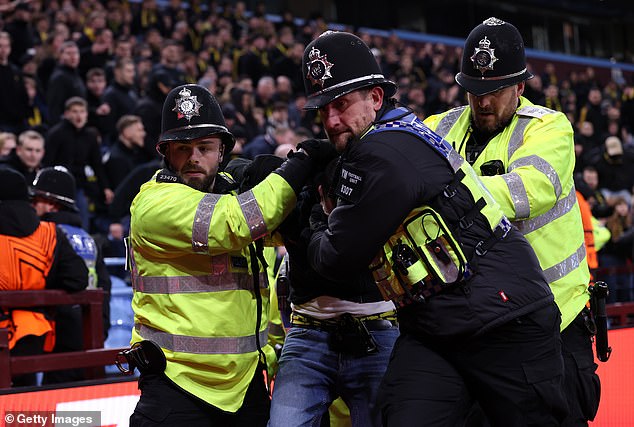 Fans were thrown out by police after fighting with the authorities and ripping out seats
