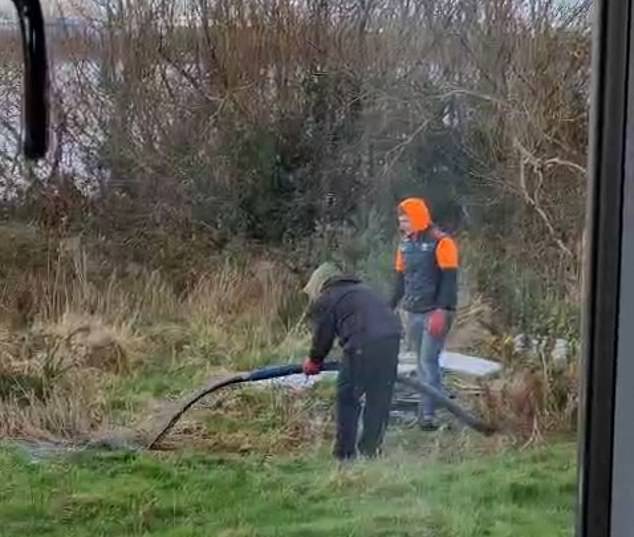 A 'local farmer' at the site appeared to pump overflowing sewage into the river next to Mr Chesworth's lodge