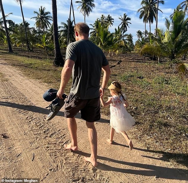 Harry with his daughter Lilibet in a photo posted by Meghan for Lilibet's birthday