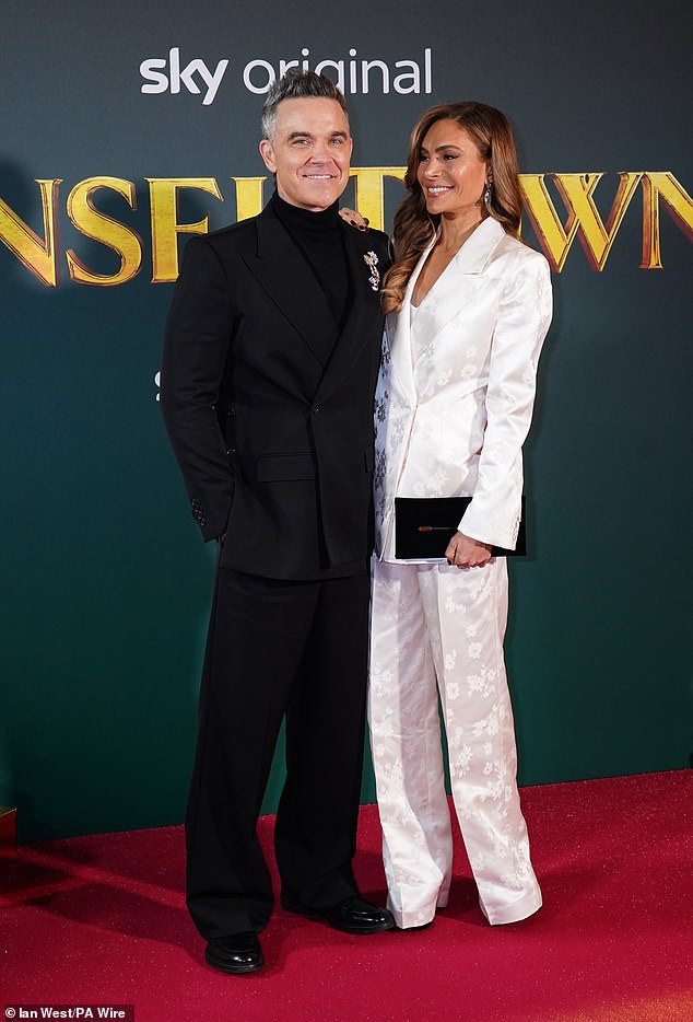 Ayda and Robbie looked loved-up as they posed together on the red carpet