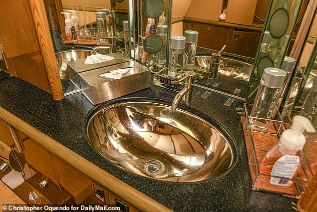 Only the best for Epstein, including pricey Voss water at the side of the bathroom sink