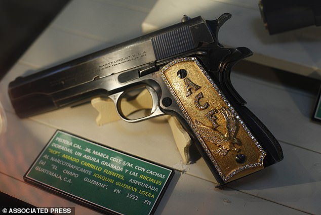 A diamond encrusted gun seized from El Chapo that's now displayed at a drug museum in Mexico City to fight against drug trafficking