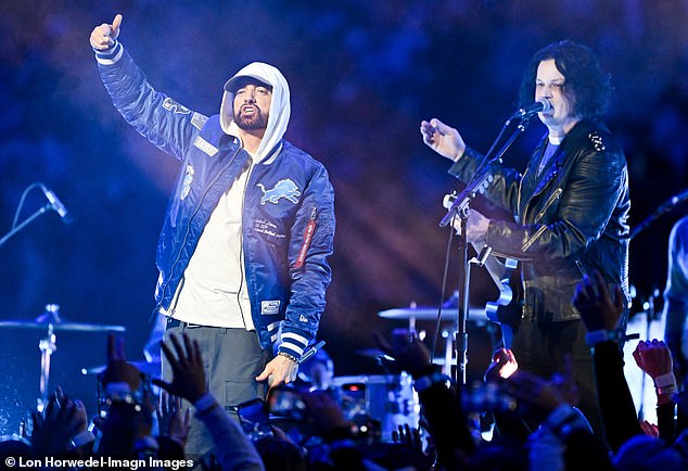 The 53-year-old rap legend executive produced the concert and handpicked the headliner and fellow Detroit native, Jack White (R), but they couldn't keep the Lions from losing to the Green Bay Packers 31-24