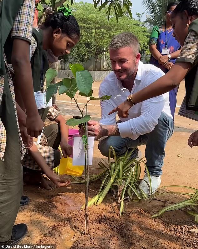 The former footballer also offered a helping hand as the kids set to work planting trees in the school garden.