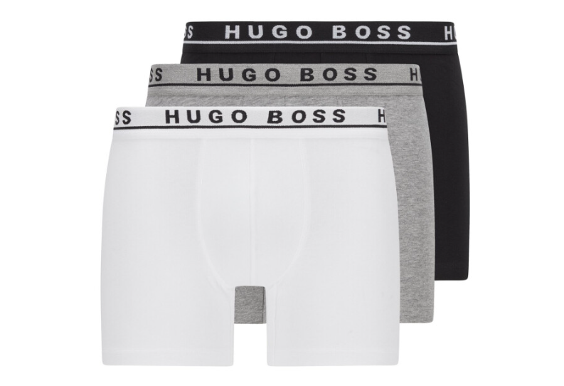 Three Hugo Boss boxer briefs in white, gray, and black.