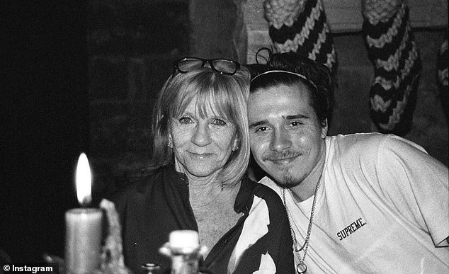 Brooklyn (pictured with Jackie) has been notably absent from every key family event over the course of the year - among them his father's milestone 50th birthday celebration