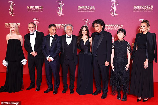 Pictured L-R Jury Members Anya Taylor-Joy, Karim AÃ¯nouz, Payman Maadi, Hakim Belabbes, Jenna Ortega, Bong Joon-ho, Celine Song and Julia Ducournau