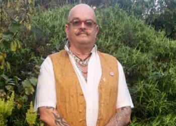 Gardner, 60, is evicted after spending 8 years turning footpath into award-winning sidewalk before neighbour complained