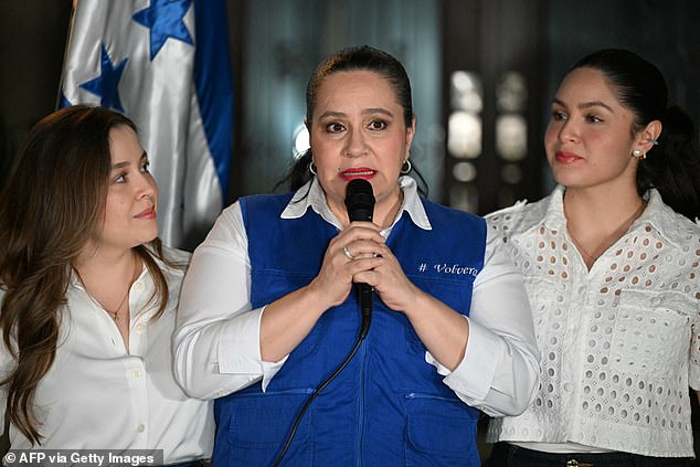 Ana Garcia de Hernandez, center, the wife of former Honduras President Juan Orlando Hernandez, talks to the media during a press conference in Tegucigalpa on Friday