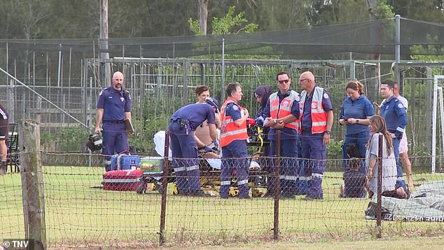 A team of paramedics are seen treating the young children at the scene