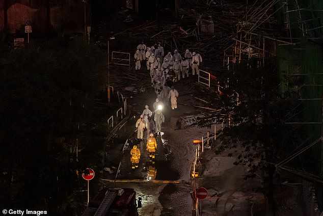 Officials are investigating why construction materials, netting and bamboo scaffolding being used in renovations to the exterior of the buildings caught fire