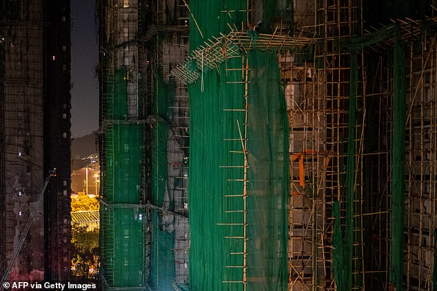 A general view shows the aftermath of a major fire that swept through several apartment blocks at the Wang Fuk Court residential estate in Hong Kong's Tai Po district on November 28, 2025