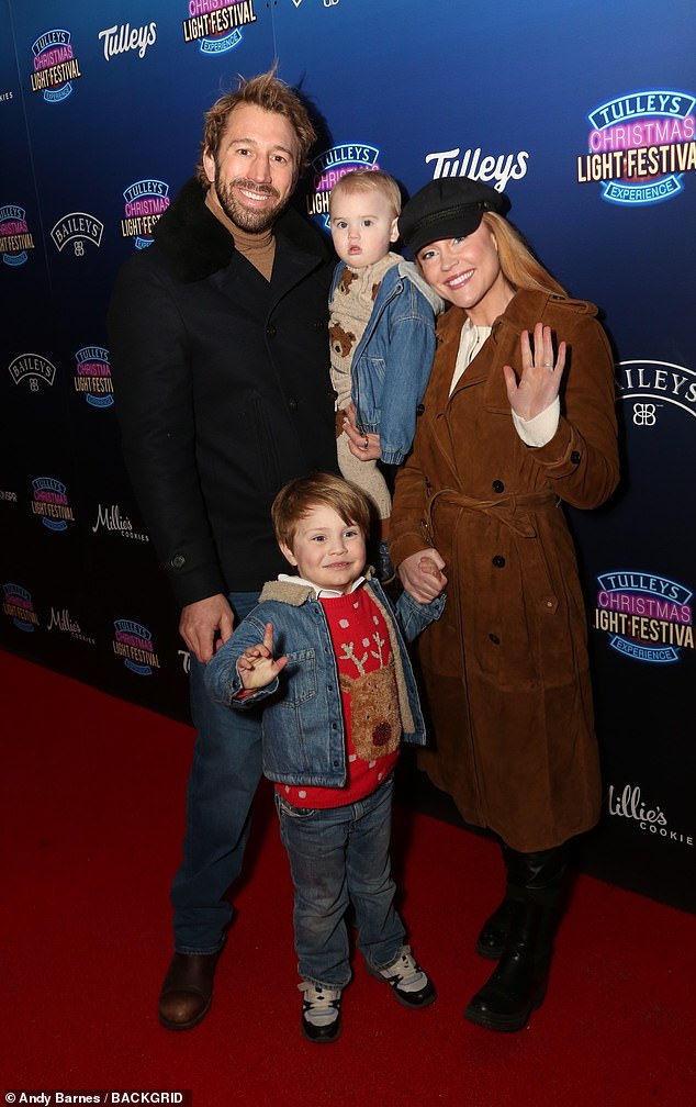 Chris Robshaw and his family smiled for pictures  as they watched thr Christmas Light Festival at Tulleys Farm