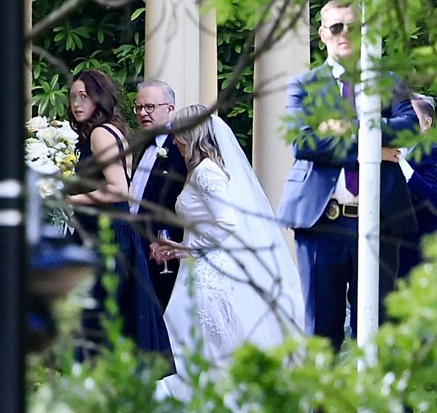 Jodie Haydon enjoys a champage after the ceremony