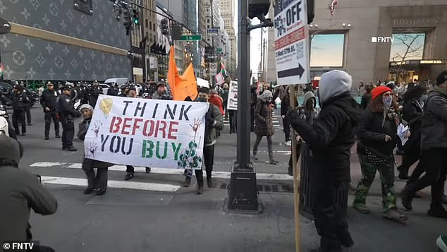 The demonstrators used signs and chants to urge boycotts of major retail brands in support of Palestine