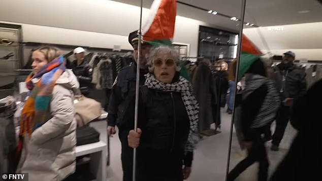 One protester was seen wearing a black-and-white keffiyeh scarf, a traditional Arab headdress that has become a symbol for Palestinian advocacy