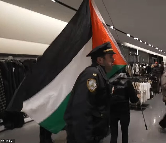 Protesters barged into the store with Palestinian flags as shoppers watched on in confusion