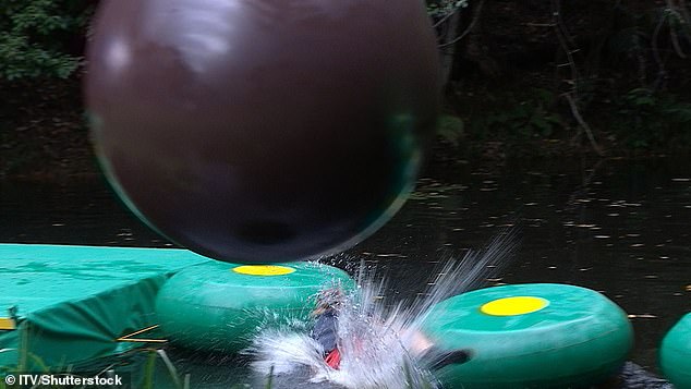 As she ran from the huge wrecking ball, Vogue suffered a nasty tumble as she made her way across the water on a series of stepping stones