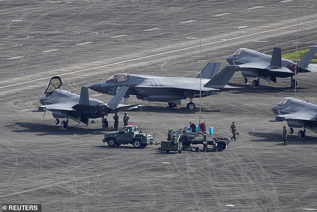 Ground crews work around US fighter jets in Puerto Rico as the army amasses a huge military presence around Venezuela
