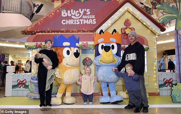 The comedian, 42, now a mother of four, appeared in high spirits with her husband Bobby as they spent quality time with their children and posed in front of the Bluey display