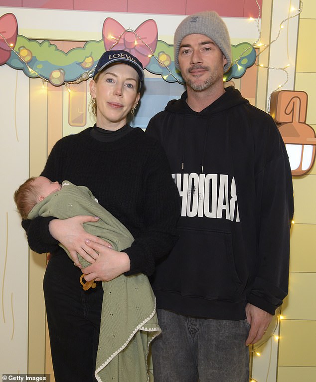 Katherine cut a casual figure for the festive outing, sporting a black round-neck jumper paired with matching trousers