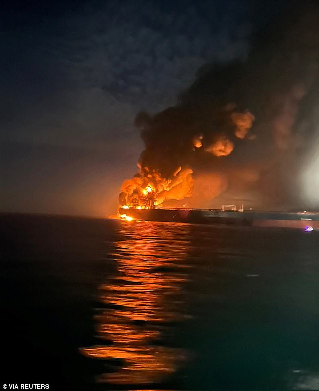 The impact triggers huge explosions that send flames and thick black smoke billowing into the sky