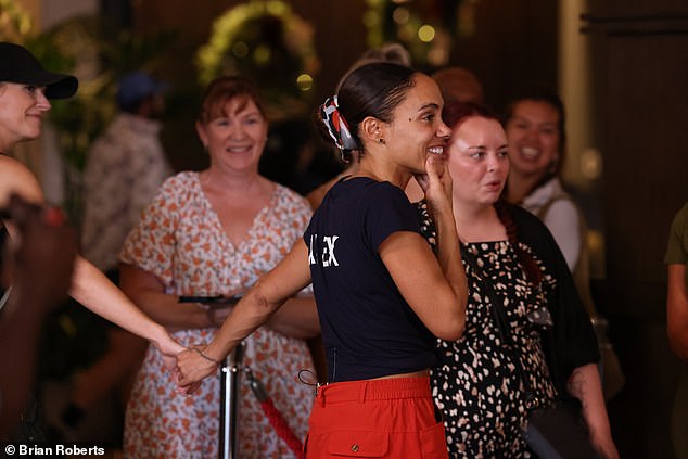 Alex was greeted off the bridge by her friend as her partner, Jess, was unable to fly out to Australia because her mother had just undergone brain surgery after a major stroke