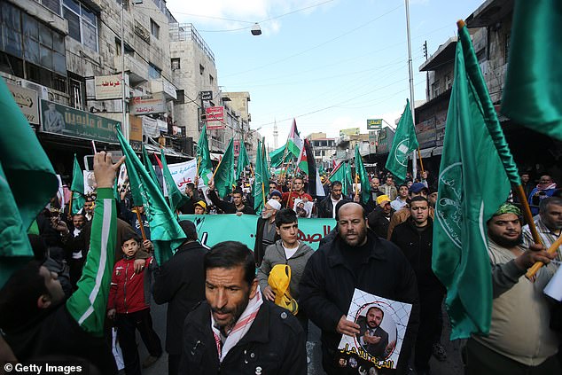 Jordanian Muslim Brotherhood supporters attend a protest in the capital city of Amman in November 2014